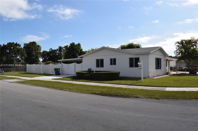 view of side of property with a lawn