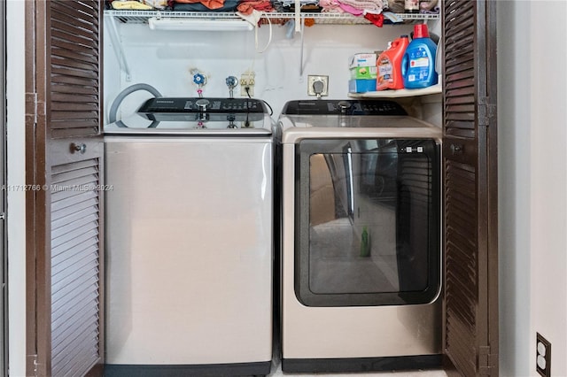 clothes washing area featuring separate washer and dryer