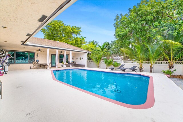 view of pool featuring ceiling fan and a patio area