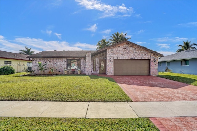 single story home with a garage and a front yard