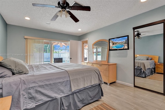 bedroom featuring a textured ceiling, access to outside, and ceiling fan