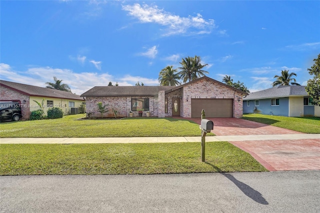 ranch-style home featuring a garage, a front lawn, and cooling unit