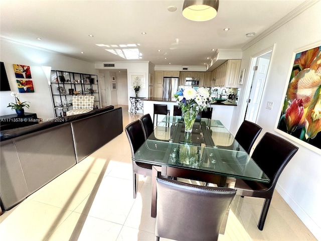 tiled dining space featuring ornamental molding