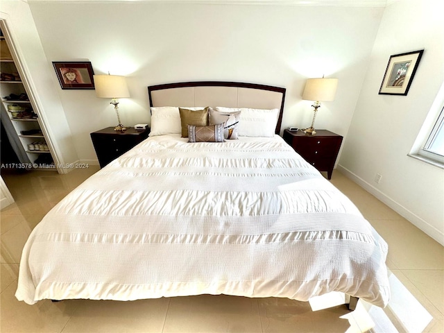 bedroom with a walk in closet and a closet