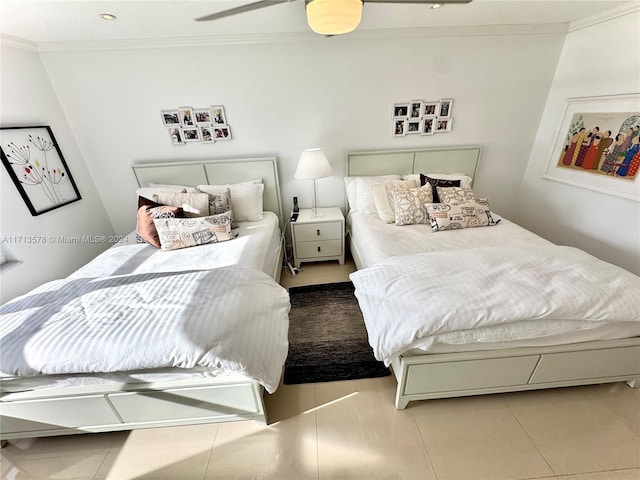 bedroom featuring ceiling fan, tile patterned flooring, and ornamental molding