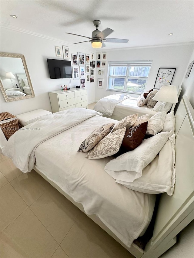 bedroom featuring tile patterned flooring, ceiling fan, and ornamental molding