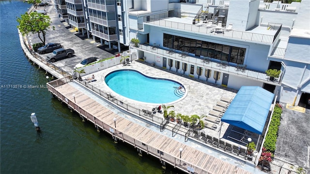 view of pool with a water view