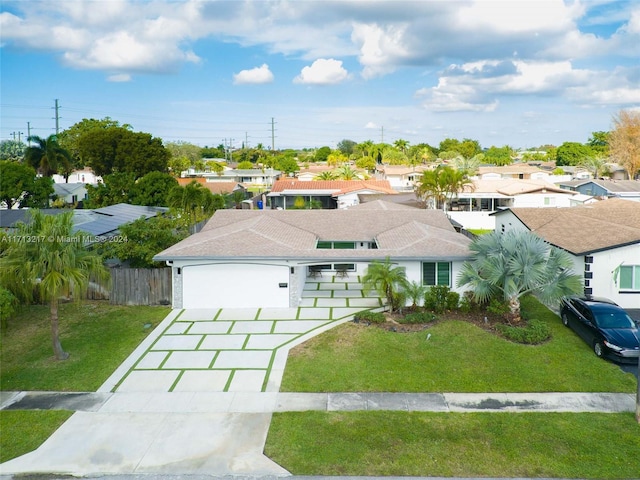 view of front of house with a front lawn and a garage