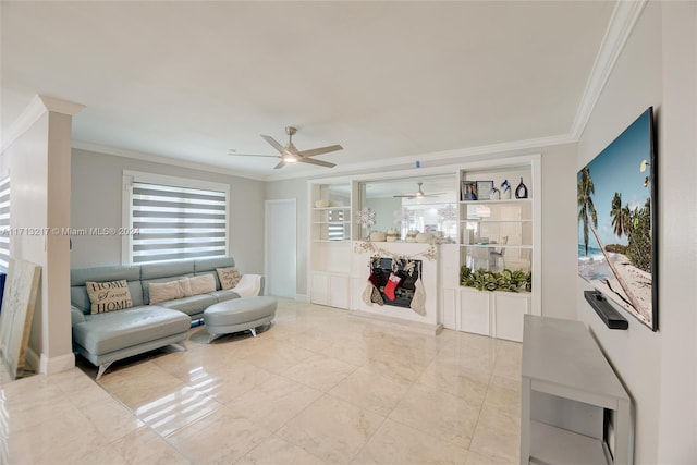 living room with ceiling fan, built in features, and crown molding