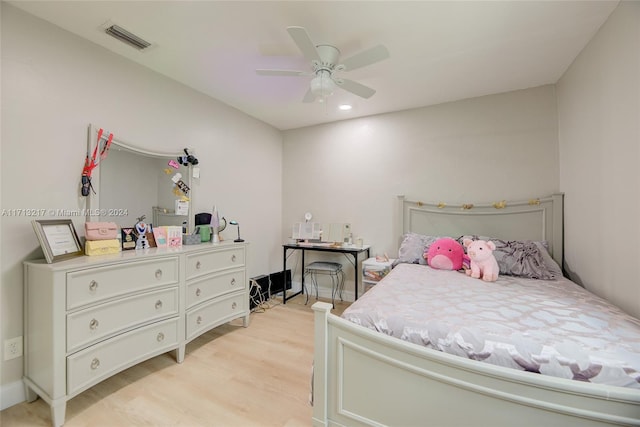 bedroom with ceiling fan and light wood-type flooring