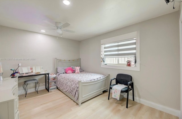 bedroom featuring light hardwood / wood-style floors and ceiling fan