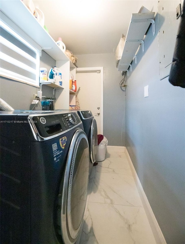 laundry room featuring separate washer and dryer