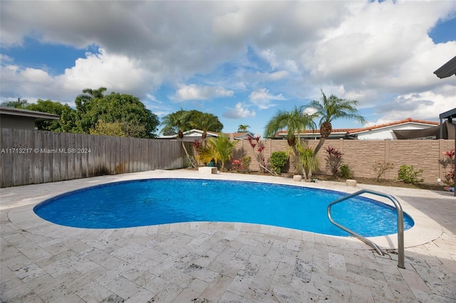 view of swimming pool with a patio area