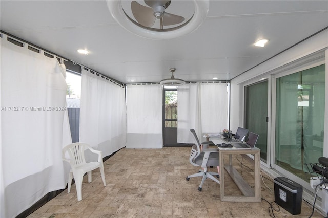 office space with plenty of natural light and ceiling fan