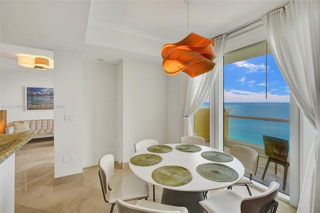 dining area featuring a water view