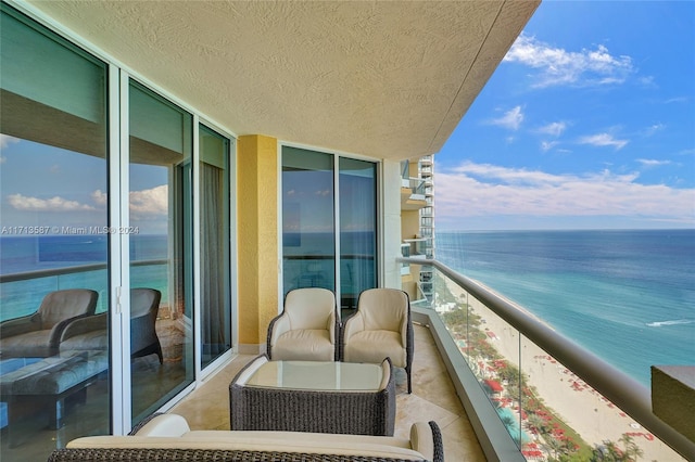 balcony featuring a water view