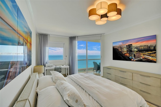 bedroom featuring ornamental molding and access to outside