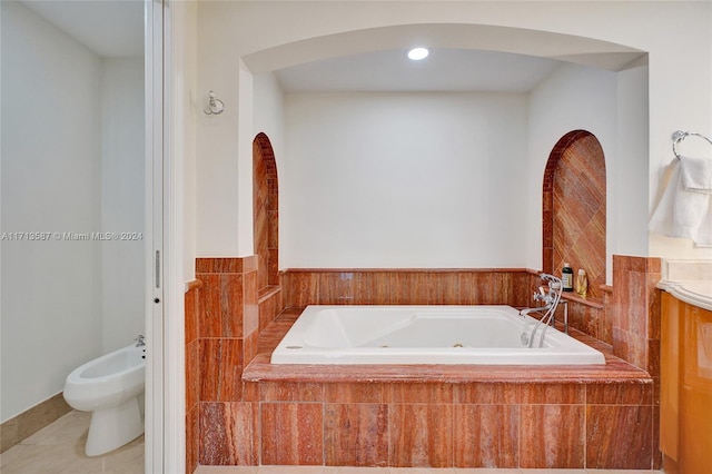 bathroom featuring a bidet, tiled bath, and tile patterned floors