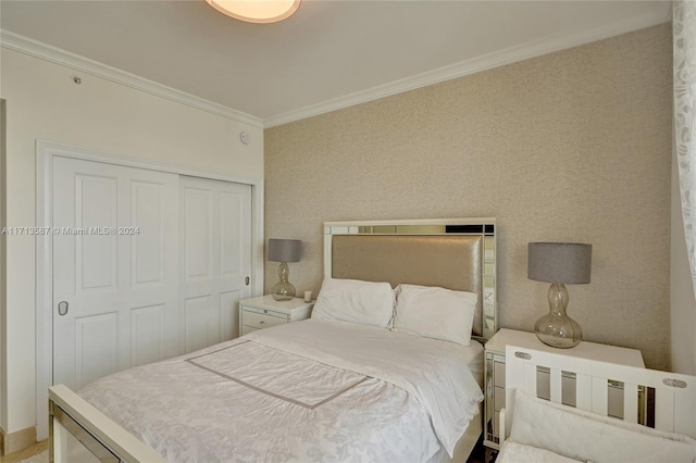 bedroom with a closet and crown molding