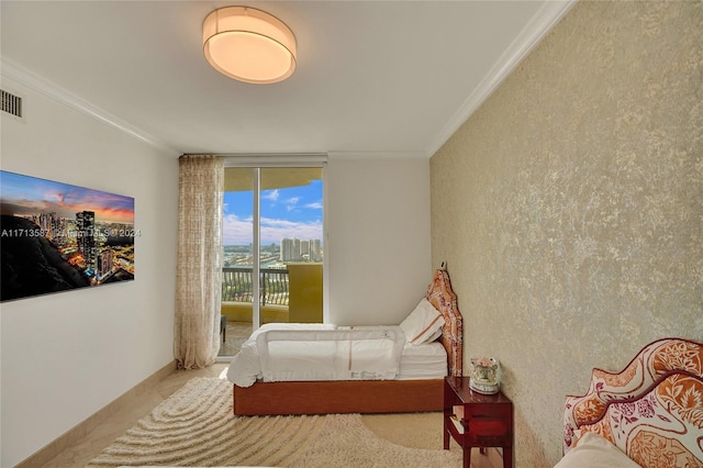 bedroom featuring crown molding and access to outside