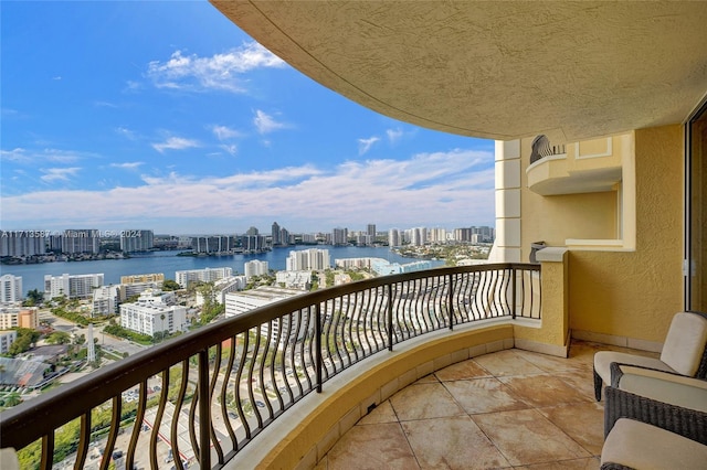 balcony featuring a water view