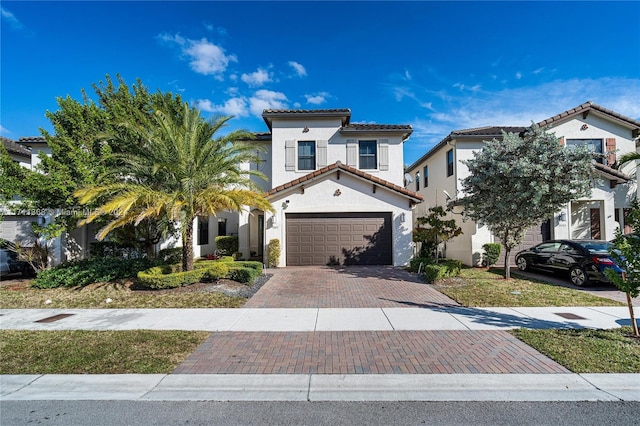 mediterranean / spanish-style house featuring a garage