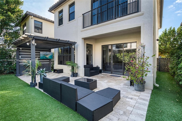 view of patio featuring outdoor lounge area, a balcony, and a pergola