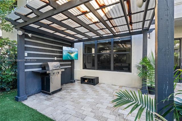 view of patio / terrace with a grill and a pergola