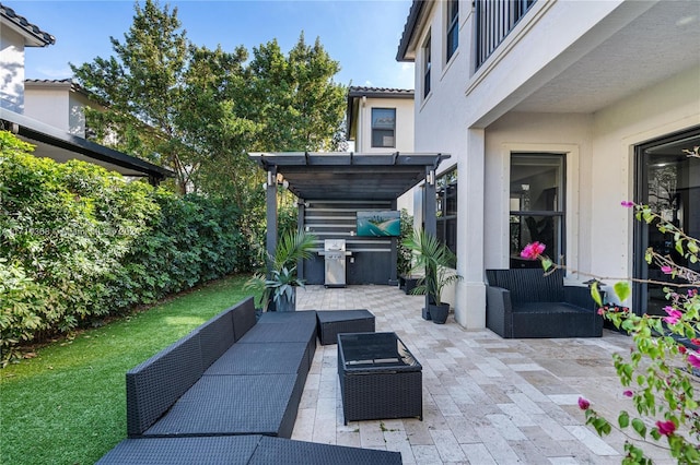 view of patio with an outdoor hangout area and grilling area