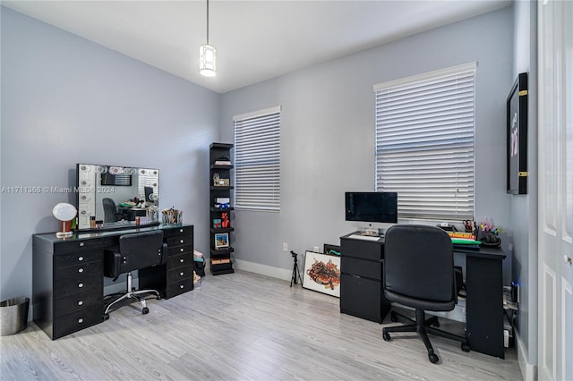 office area with light hardwood / wood-style floors