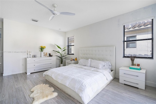 bedroom featuring light hardwood / wood-style floors and ceiling fan