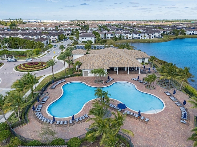 view of swimming pool with a water view