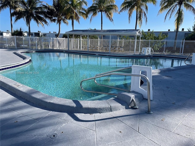 view of swimming pool with a patio area