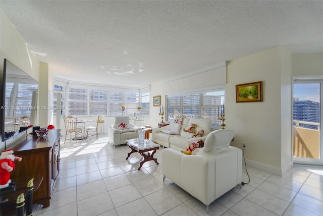 tiled living room with a wealth of natural light and a textured ceiling