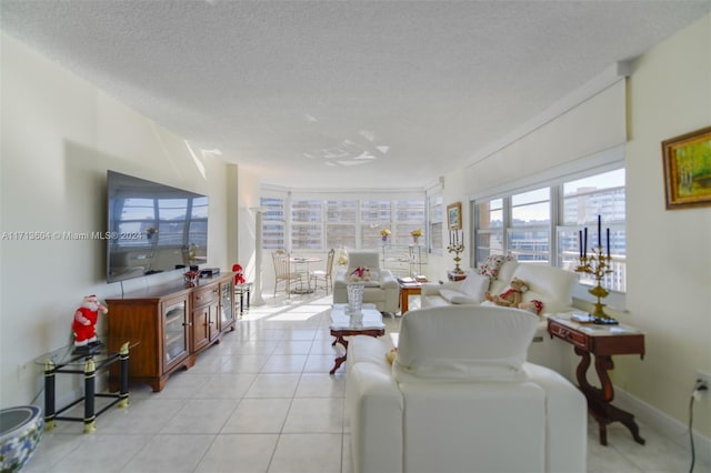 living room with light tile patterned floors and a textured ceiling