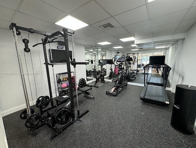 exercise room featuring a paneled ceiling