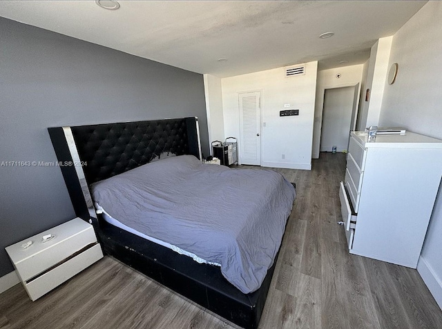 bedroom featuring hardwood / wood-style flooring