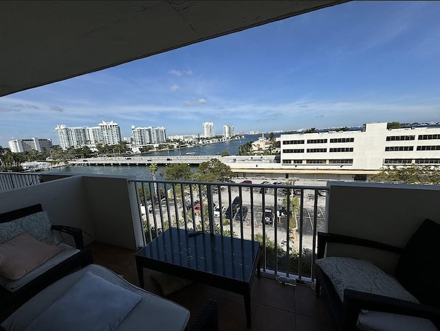 balcony featuring a water view