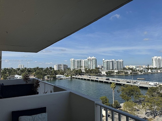 balcony featuring a water view