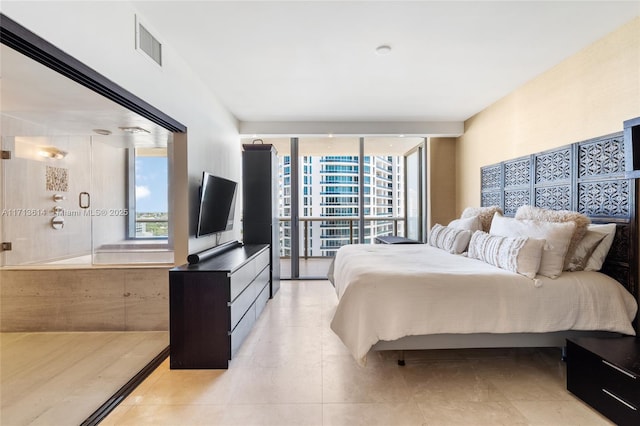 bedroom featuring light tile patterned floors