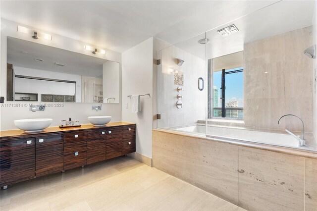 bathroom featuring vanity, tile patterned floors, and toilet