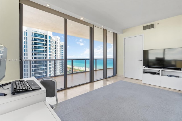 tiled living room with floor to ceiling windows