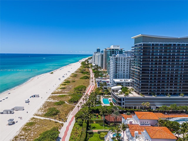 bird's eye view with a view of the beach and a water view