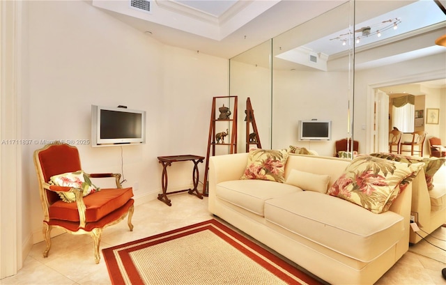 living area with light tile patterned floors, crown molding, a tray ceiling, and visible vents