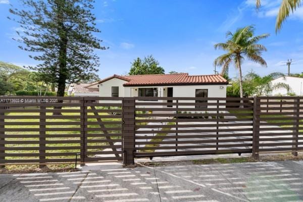 view of gate featuring a fenced front yard