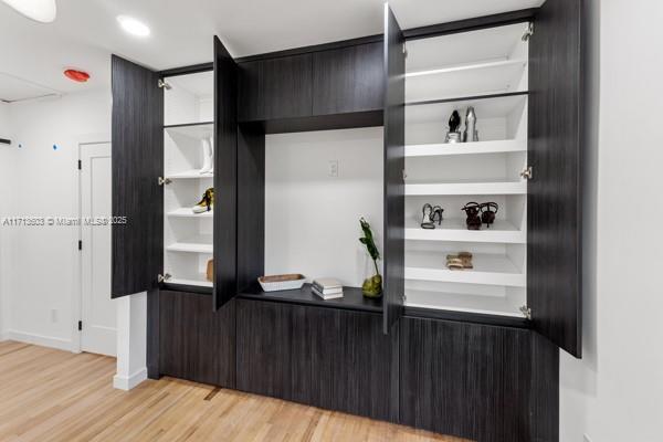 bar featuring light hardwood / wood-style floors