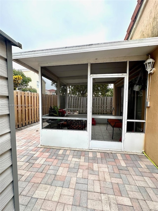 view of patio / terrace with a sunroom