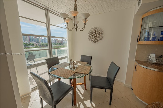 tiled dining space featuring a chandelier, floor to ceiling windows, and brick ceiling