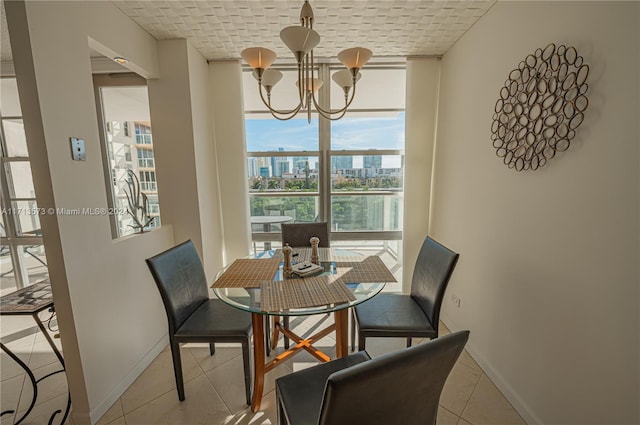 dining space featuring light tile patterned floors, a wall of windows, a notable chandelier, and brick ceiling