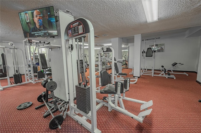 workout area featuring a textured ceiling